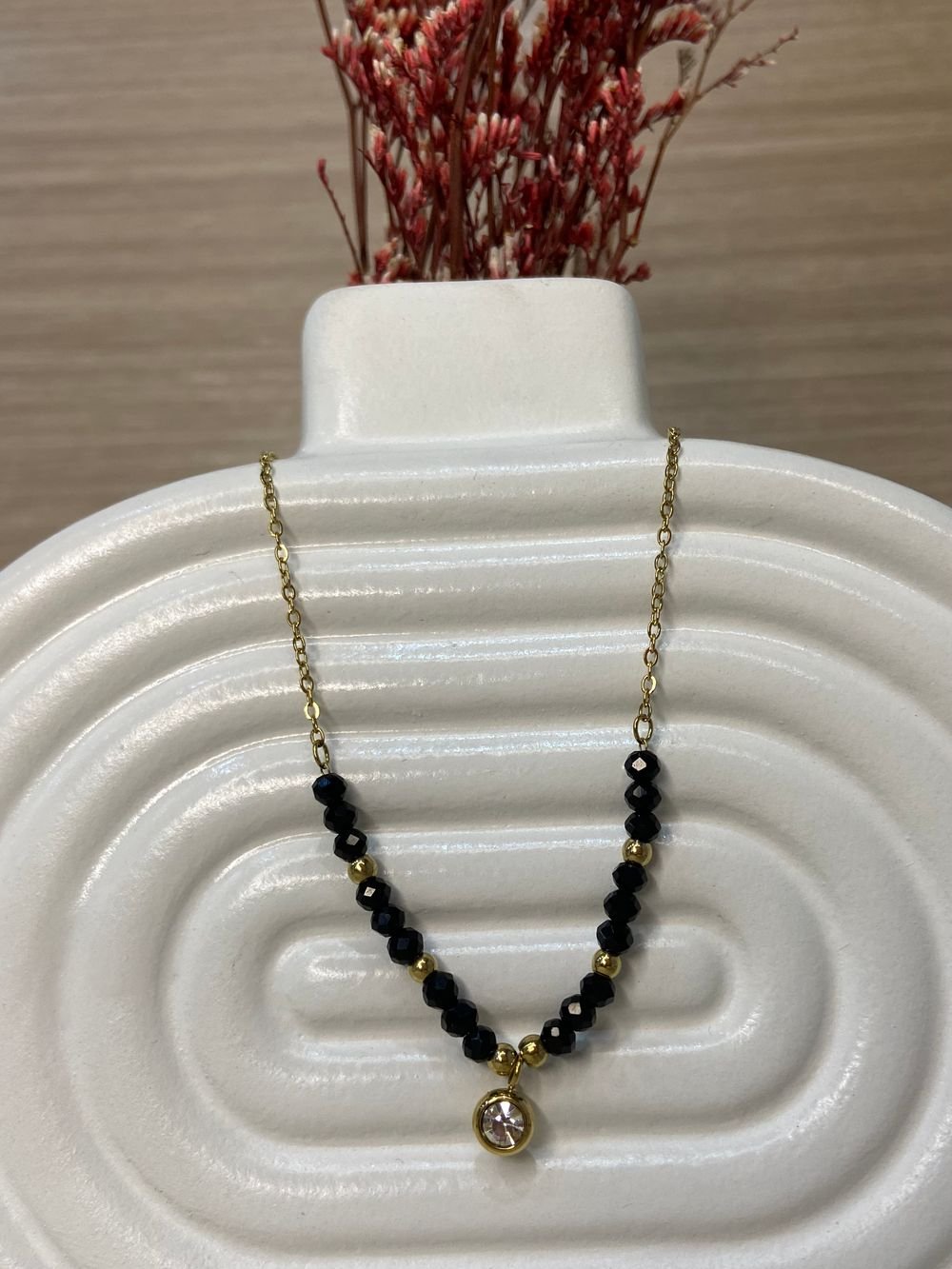 Collar Estelar Onyx Dorado en acero inoxidable